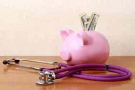 stethoscope and piggy bank